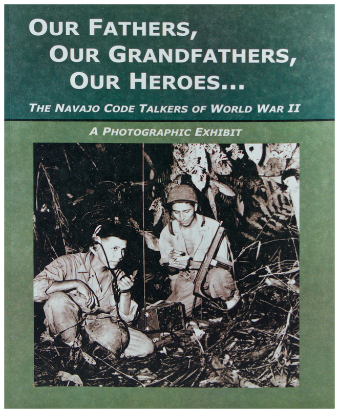Cover of a photographic exhibit book titled 'OUR FATHERS, OUR GRANDFATHERS, OUR HEROES. A black and white photograph of two Code Talkers on a radio during WWII