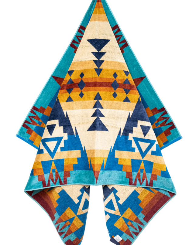 Colorful patterned fabric with geometric design on a white background