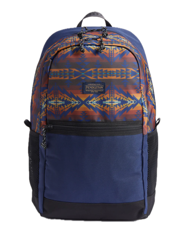 A navy-colored Pendleton Trapper Peak backpack with a geometric pattern in blue and orange on the side.