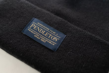 Load image into Gallery viewer, Close up of the Pendleton tag on a black classic beanie
