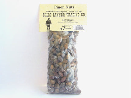 A clear plastic package containing 4 ounces of roasted piñon nuts, with a label displaying the brand name, product name, and weight.
