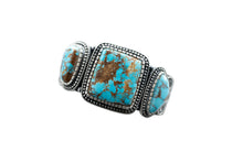 Load image into Gallery viewer, Top of a silver bracelet with three Royston Turquoise stones, by Navajo Silversmith Matthew Charley, with a solid white background. 
