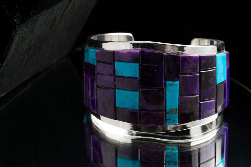 A multicolored inlay bracelet with a mix of purple and blue turquoise