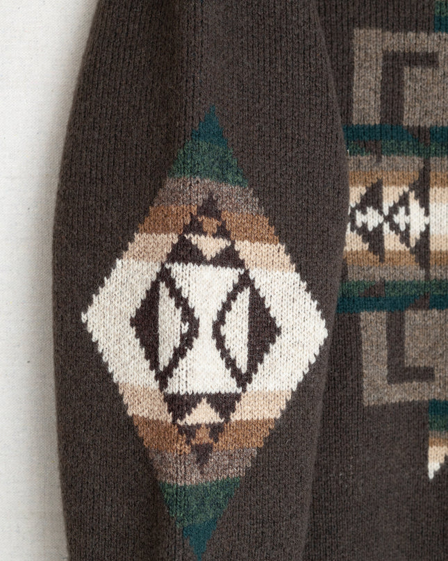 Closeup of Chief Joseph pattern on a brown pullover sweater sleeve
