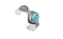 Load image into Gallery viewer, Silver bracelet with deep black lines and a turquoise stone on a white background

