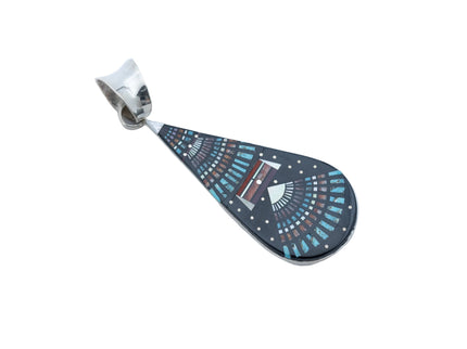 Teardrop-shaped pendant with decorative night Sky pattern, placed in a silver plate and silver bail at the top, on a white background