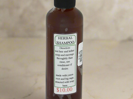 Small clear bottle filled with Navajo herbal shampoo with a simple label