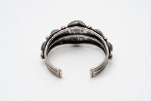 Load image into Gallery viewer, Back view of a Native American silver and turquoise bracelet on a white background
