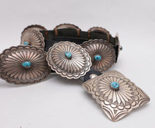 Load image into Gallery viewer, Black leather concho belt with silver concho buckles on a white background
