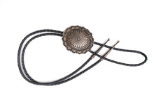 Load image into Gallery viewer, Vintage Navajo silver bolo tie with black braided cord on a white background
