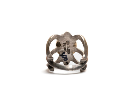 Bottom of silver cast cut-out ring showcases the stamp imprint that says "sterling silver"