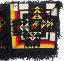 Load image into Gallery viewer, Pendleton Chief Joseph Blanket in Black featuring a traditional Native American-inspired geometric pattern with arrow motifs, folded neatly to show intricate design and soft wool texture. Inside View
