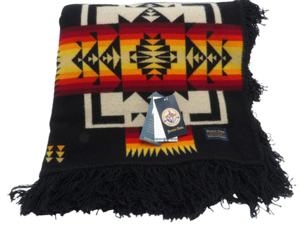 Pendleton Chief Joseph Blanket in Black featuring a traditional Native American-inspired geometric pattern with arrow motifs, folded neatly to show intricate design and soft wool texture. front View 