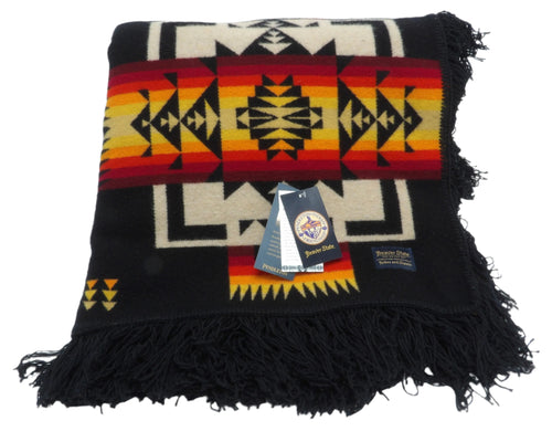 Pendleton Chief Joseph Blanket in Black featuring a traditional Native American-inspired geometric pattern with arrow motifs, folded neatly to show intricate design and soft wool texture. front View 