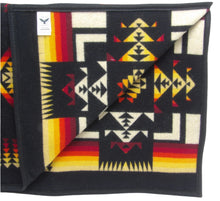 Load image into Gallery viewer, Pendleton Chief Joseph Blanket in black, featuring a traditional Native American-inspired geometric pattern with arrow motifs, folded neatly to show intricate design and soft wool texture. Inside View 
