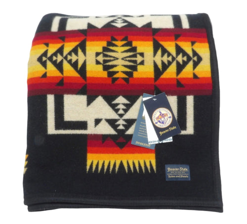 Pendleton Chief Joseph Blanket in Black featuring a traditional Native American-inspired geometric pattern with arrow motifs, folded neatly to show intricate design and soft wool texture. front View 