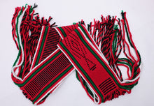 Load image into Gallery viewer, Dark red traditional sash with two green lines and black and white highlights rolled up on a white background
