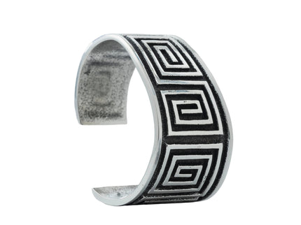 Navajo Cuff bracelet with square geometric pattern on a light gray background