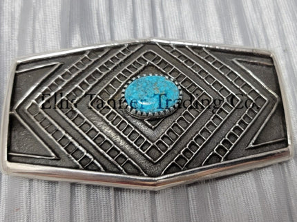 Handmade silver belt buckle with one Kingman Turquoise stone in the center