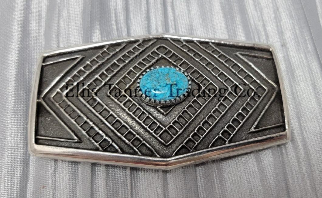 Handmade silver belt buckle with one Kingman Turquoise stone in the center
