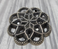Load image into Gallery viewer, Silver Cut out sand cast, pendant displayed on top of a shiny silver cloth 
