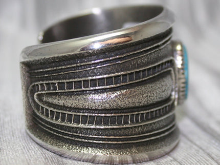 A bold sand-cast cuff featuring intricate textures and patterns, Side Profile