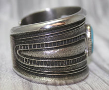 Load image into Gallery viewer, A bold sand-cast cuff featuring intricate textures and patterns, Side Profile
