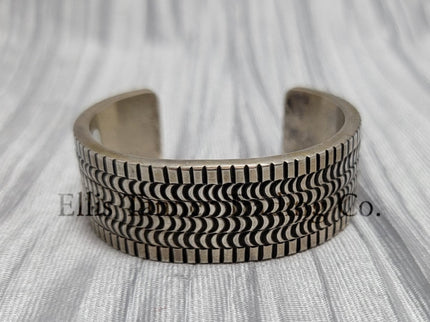 heavy silver, Bracelet features intricate stamped detailing for a unique and stylish look. Displayed on a soft silver cloth, 
