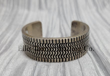 Load image into Gallery viewer, heavy silver, Bracelet features intricate stamped detailing for a unique and stylish look. Displayed on a soft silver cloth, 
