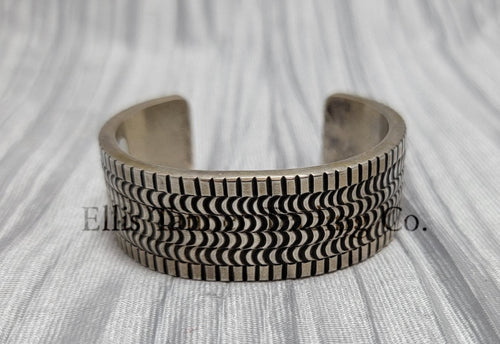 heavy silver, Bracelet features intricate stamped detailing for a unique and stylish look. Displayed on a soft silver cloth, 