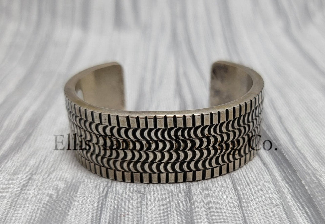 heavy silver, Bracelet features intricate stamped detailing for a unique and stylish look. Displayed on a soft silver cloth, 