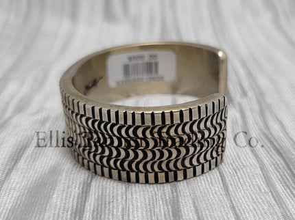 heavy silver, Bracelet features intricate stamped detailing for a unique and stylish look. Displayed on a soft silver cloth, Side 