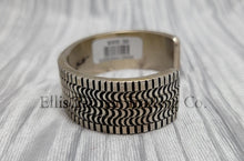 Load image into Gallery viewer, heavy silver, Bracelet features intricate stamped detailing for a unique and stylish look. Displayed on a soft silver cloth, Side 
