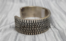 Load image into Gallery viewer, heavy silver, Bracelet features intricate stamped detailing for a unique and stylish look. Displayed on a soft silver cloth, Side
