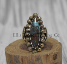 Load image into Gallery viewer, Tommy Jackson 14k overlay with Bisbee turquoise on wooden display 
