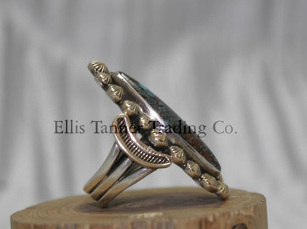 Ring by Tommy Jackson 14k overlay with Bisbee turquoise on wooden display 