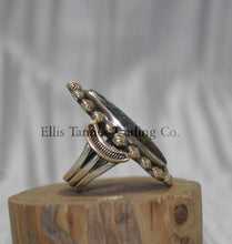 Load image into Gallery viewer, Ring by Tommy Jackson 14k overlay with Bisbee turquoise on wooden display 
