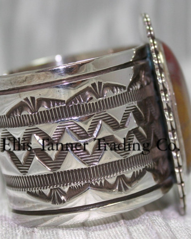 Large silver stamped cuff, side view with hand stamped designs, 