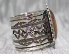 Load image into Gallery viewer, Large silver stamped cuff, side view with hand stamped designs, 
