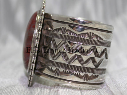 Large silver stamped cuff, side view with hand stamped designs, 