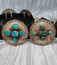 Load image into Gallery viewer, A handcrafted Navajo concho belt with detailed sterling silver conchos, each embedded with mixed turquoise stones of varying shades and natural patterns, attached to a black leather strap.
